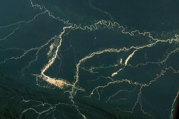 Satellite images of the Amazon basin show the impact of mining operations on deforestation (image courtesy of NASA)